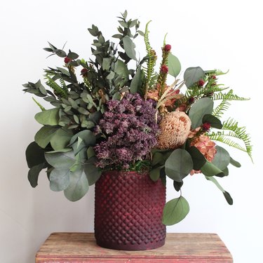 dried fall flower arrangement in jewel tones