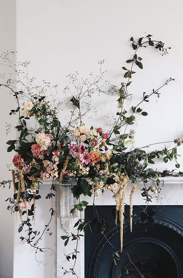 romantic fall flower arrangement on the mantel