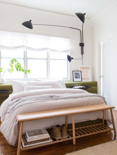 relaxed Roman shades at windows in bedroom