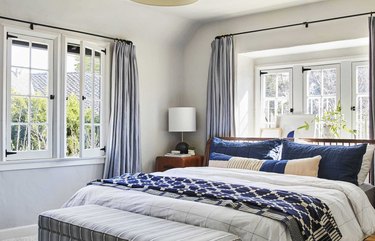 navy and white coastal bedroom with modern undertones