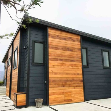 Black and wood finish exterior paneling on modular home