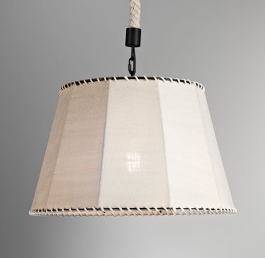 pendant light with burlap shade and whipstitching at the top and bottom