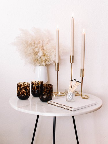 modern fall decor with white side table with candles and glasses