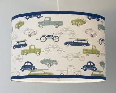 drum shaped pendant light with cars on the shade
