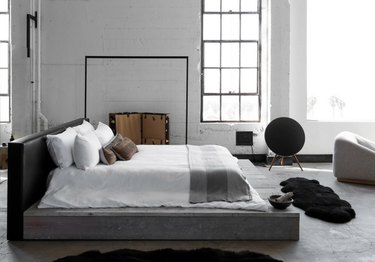gray industrial bedroom with platform bed