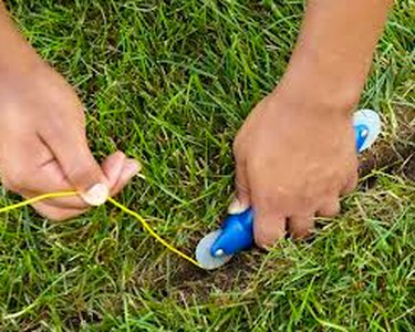 Burying wire in a shallow trench.