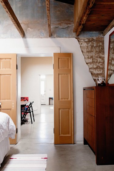 Adobe walls and exposed beams.