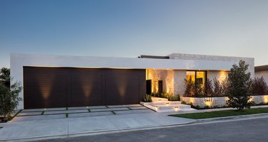 Exterior Garage Lighting on modern home exterior with split black garage