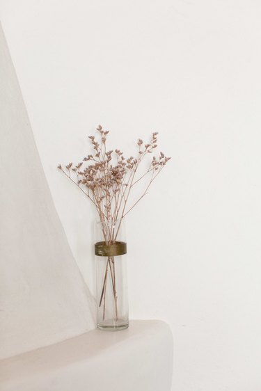 Flowers on the adobe mantel.