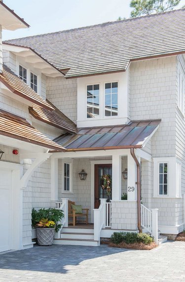 light gray exterior paint with shingle house and metal roof