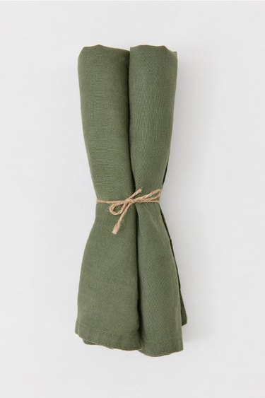 green linen napkins tied with twine