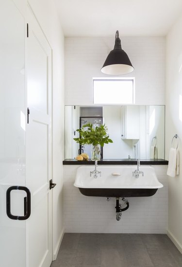 modern farmhouse trough sink black and white bathroom