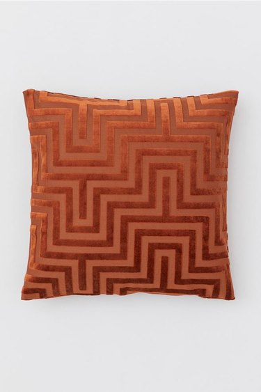 rust colored geometric pillow