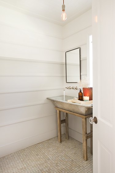 rustic bathroom with repurposed trough sink