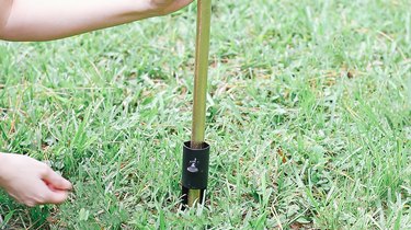 Installing torch in ground with torch stake