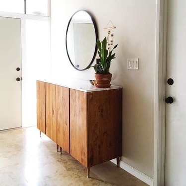 console table in entryway with top wrapped in marble plywood