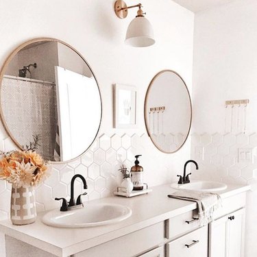 double vanity unit with self-rimming bathroom sinks and hexagonal backsplash tile