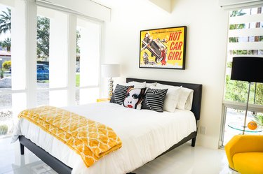 Bedroom with white, black, and yellow colors