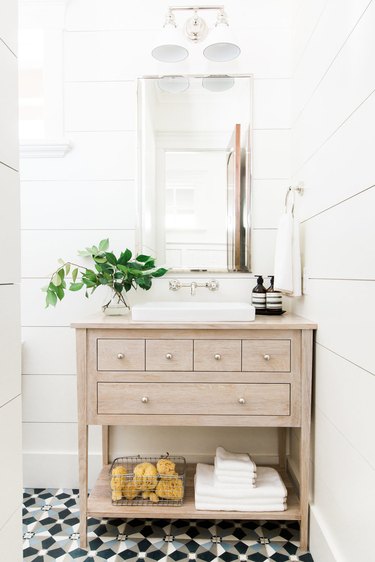 modern rectangular self-rimming bathroom sink with wood vanity cabinet and shiplap walls