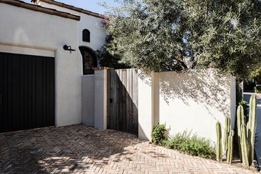 Exterior Garage Lighting on Meditteranean exterior with simple sconce light