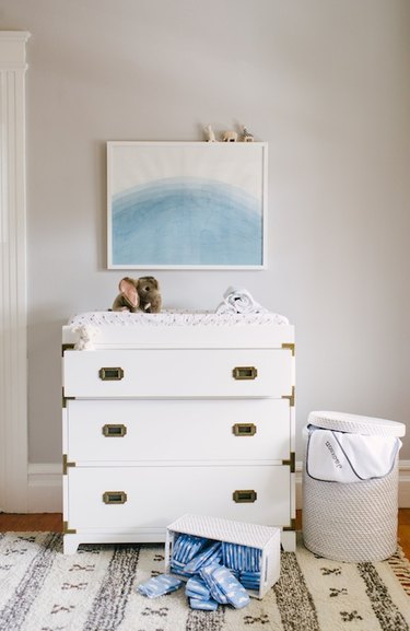 nautical themed nursery with chest of drawers as changing table