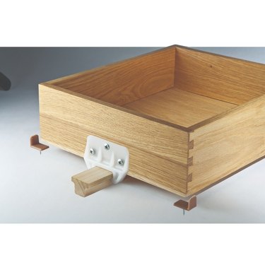 Wooden drawer glide.
