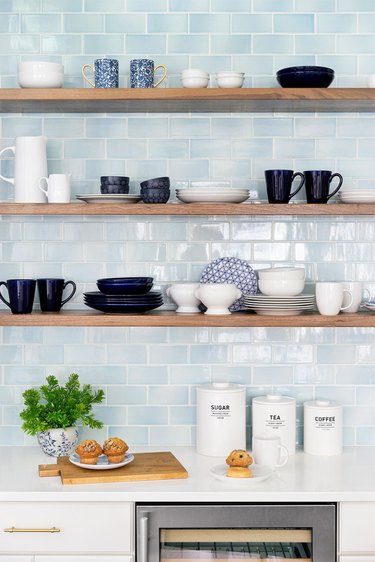 blue subway tile in modern kitchen with open shelving