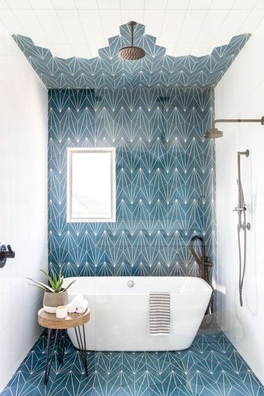 blue patterned bathroom with open shower