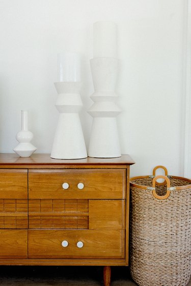 Ceramic pieces on a vintage dresser.