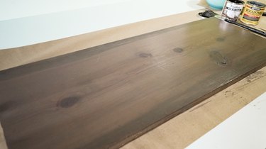 Blending gray and brown wood stain for faux weathered wood finish.