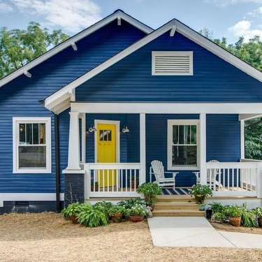 yellow and navy blue home exterior with white trim