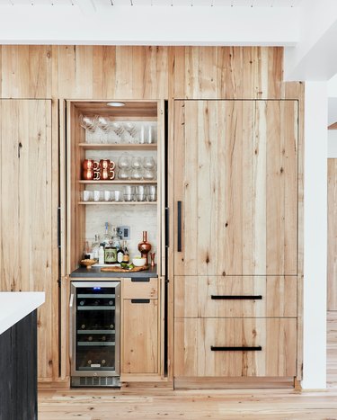 wood kitchen cabinets with black hardware