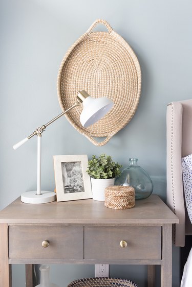 Coastal paint colors in bedroom with hanging basket on blue gray wall