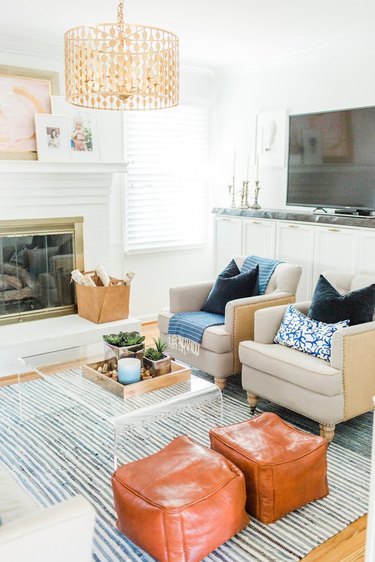 Coastal paint colors in living room with boho decor accents and white walls