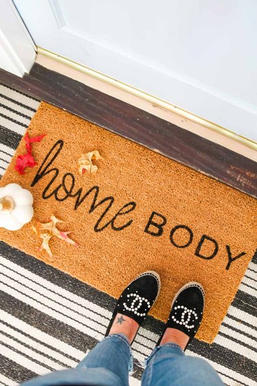 Homebody fall doormat with striped rug and sparkly shoes