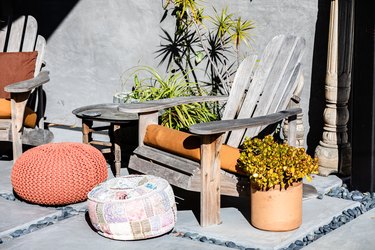 Adirondack Chairs with potted plant and footstool