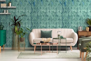 living room with green damask wallpaper