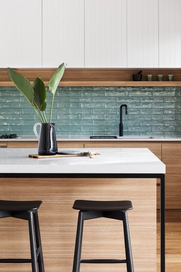 textured bohemian kitchen backsplash idea with wood cabinets and white countertop