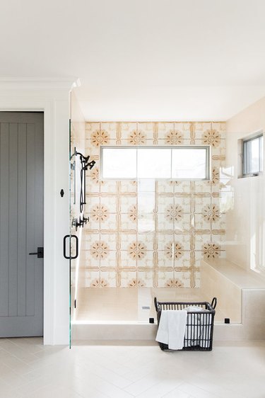bohemian bathroom idea with patterned wall tile and walk-in shower