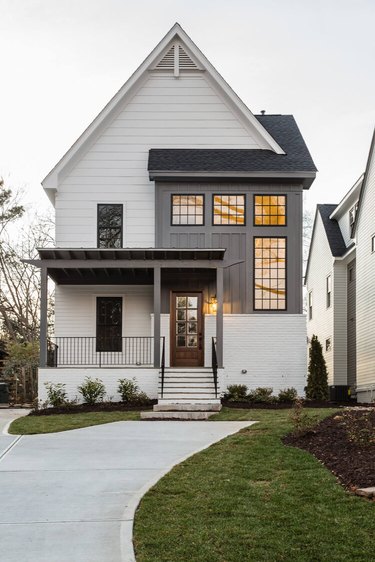 pointed gable on a gray and white farmhouse