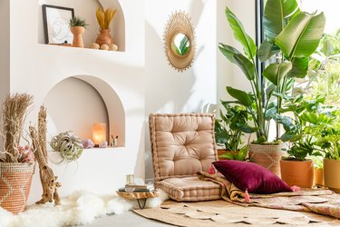 Boho living room with plants near window