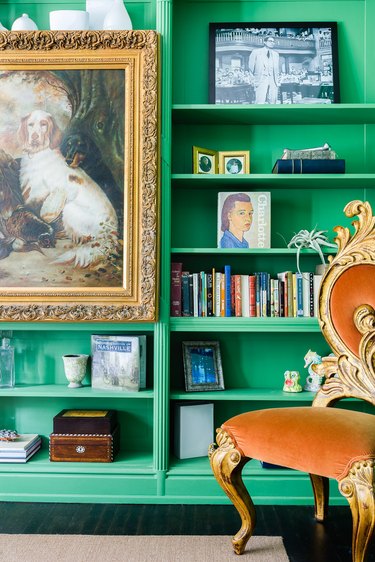Green home office library with antiques, art and Victorian details by JL Design