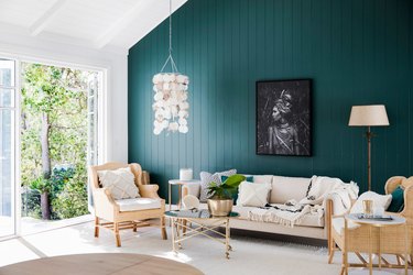 living room with teal green painted wall