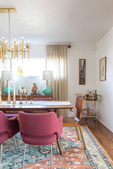 Midcentury dining room idea with gold chandelier