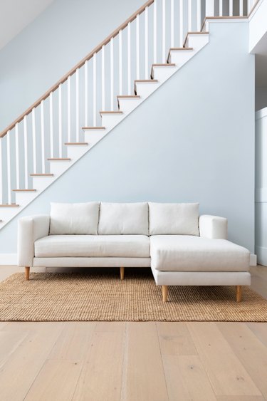 white couch near stairs