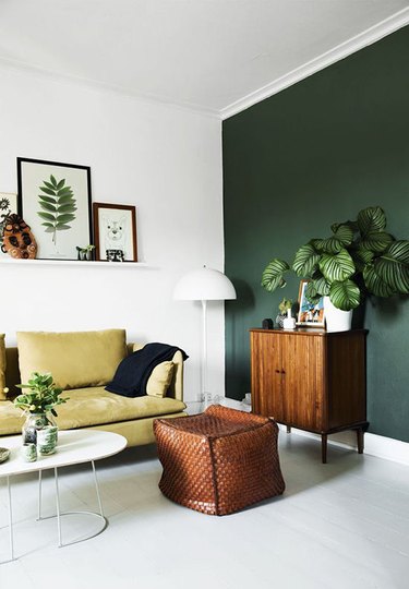 hunter green accent wall in living room