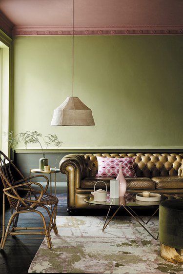 green colorblocked living room with painted ceiling