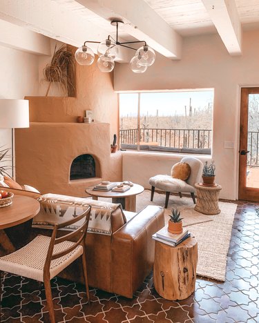 terra cotta color fireplace in cream living room