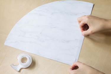 Sticking double-sided tape to paper