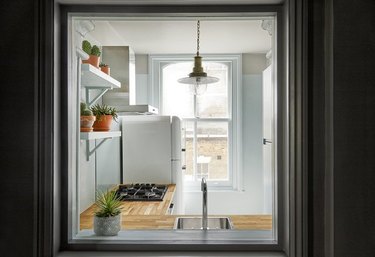 gray kitchen with eggshell blue paint destails and windows Tone On Tone Paint Ideas